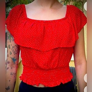 Red semi crop top blouse.